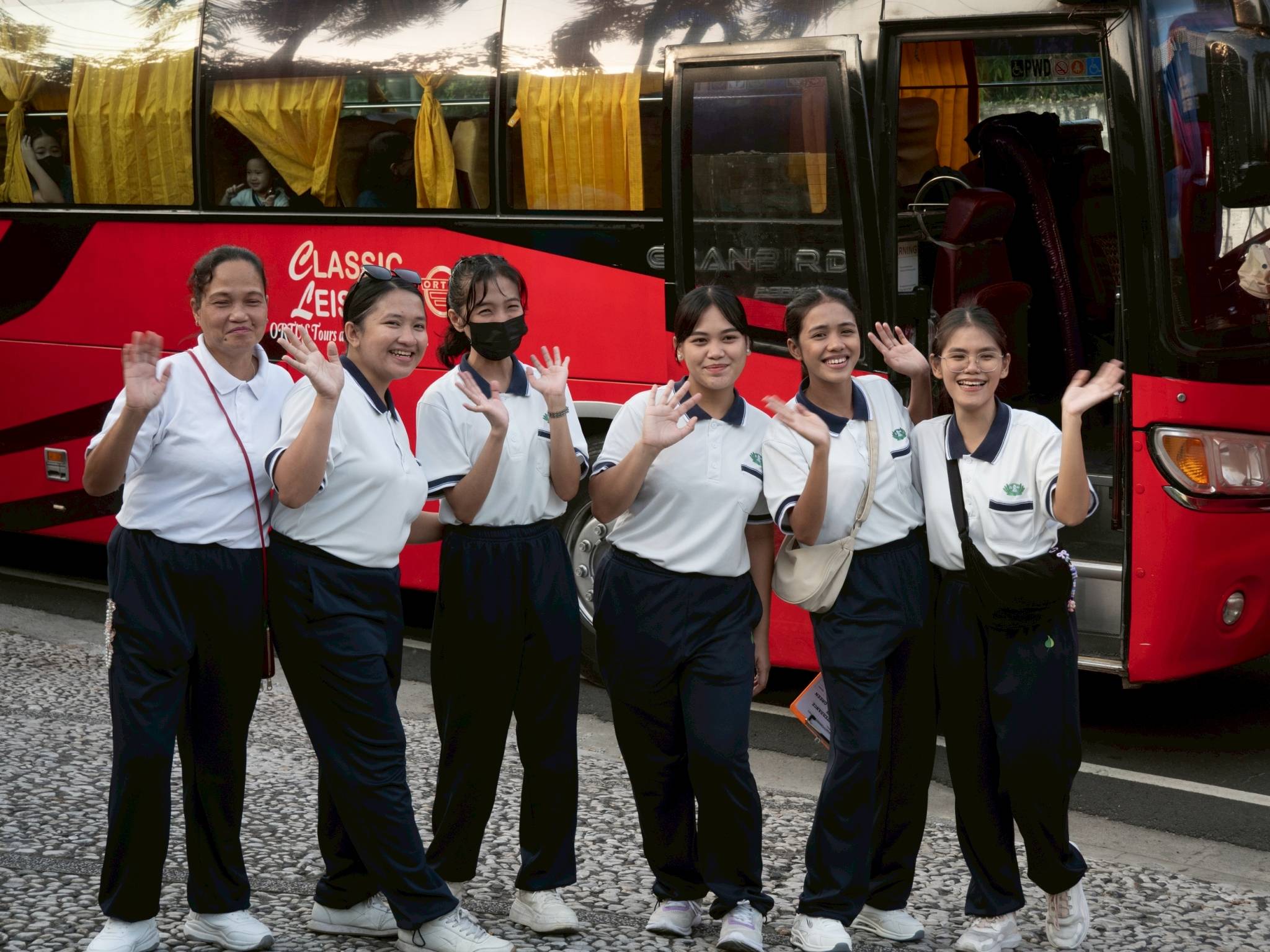Preschool teachers pose for a group photo while waiting for students and their families to arrive.