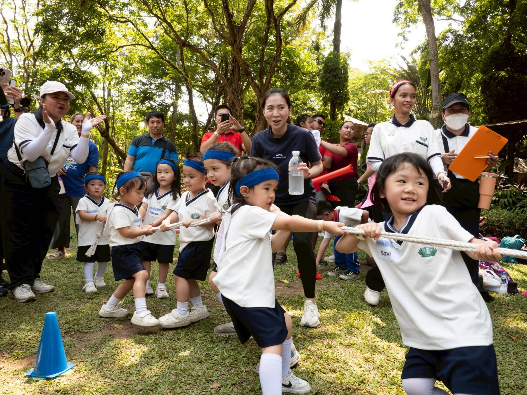 With the support of their parents and guardians, preschool students gave their all in their  tug-of-war game.