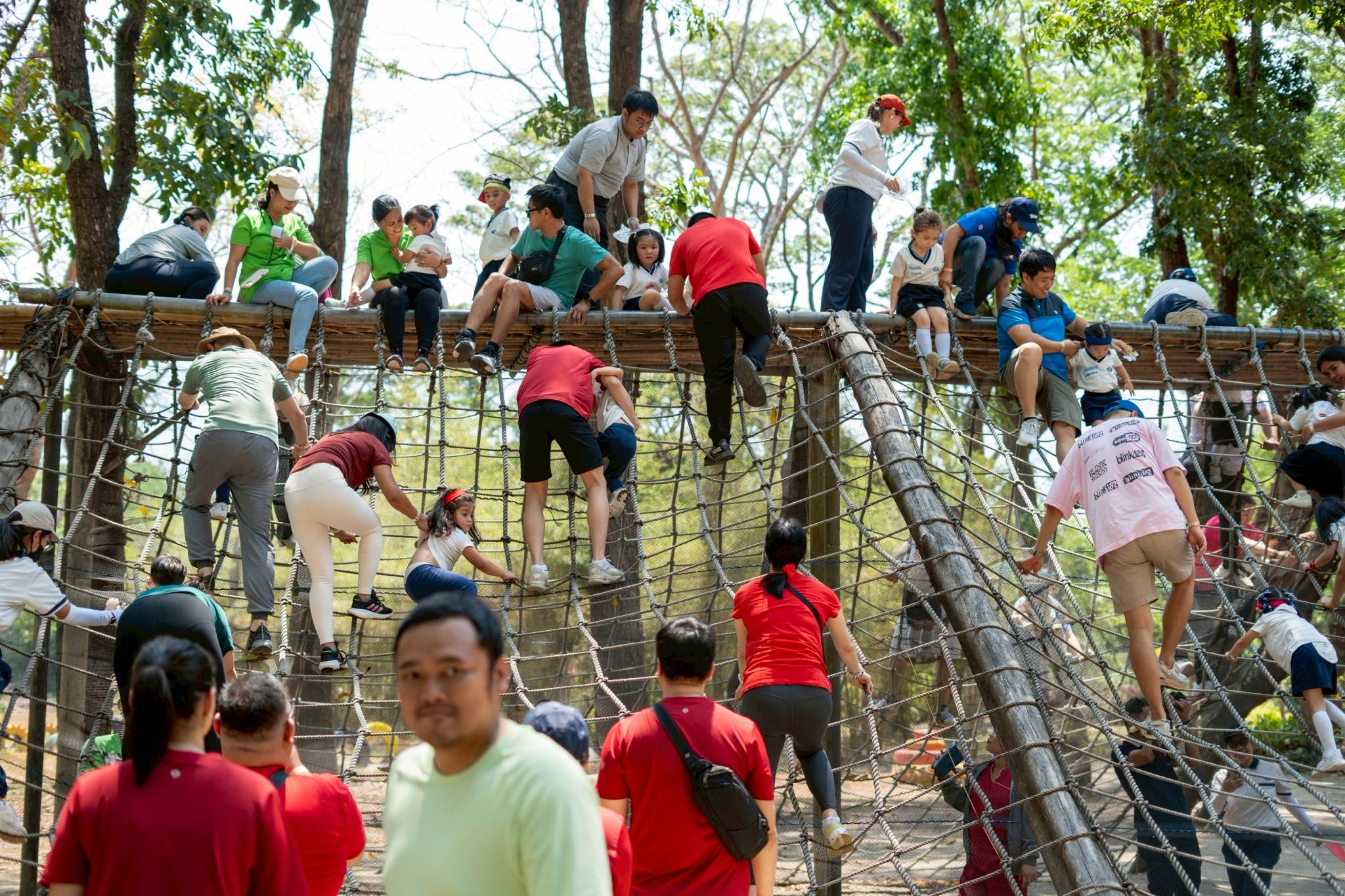 The obstacle relay included climbing up and down an A-frame cargo net, a fun challenge for both parents and kids. 