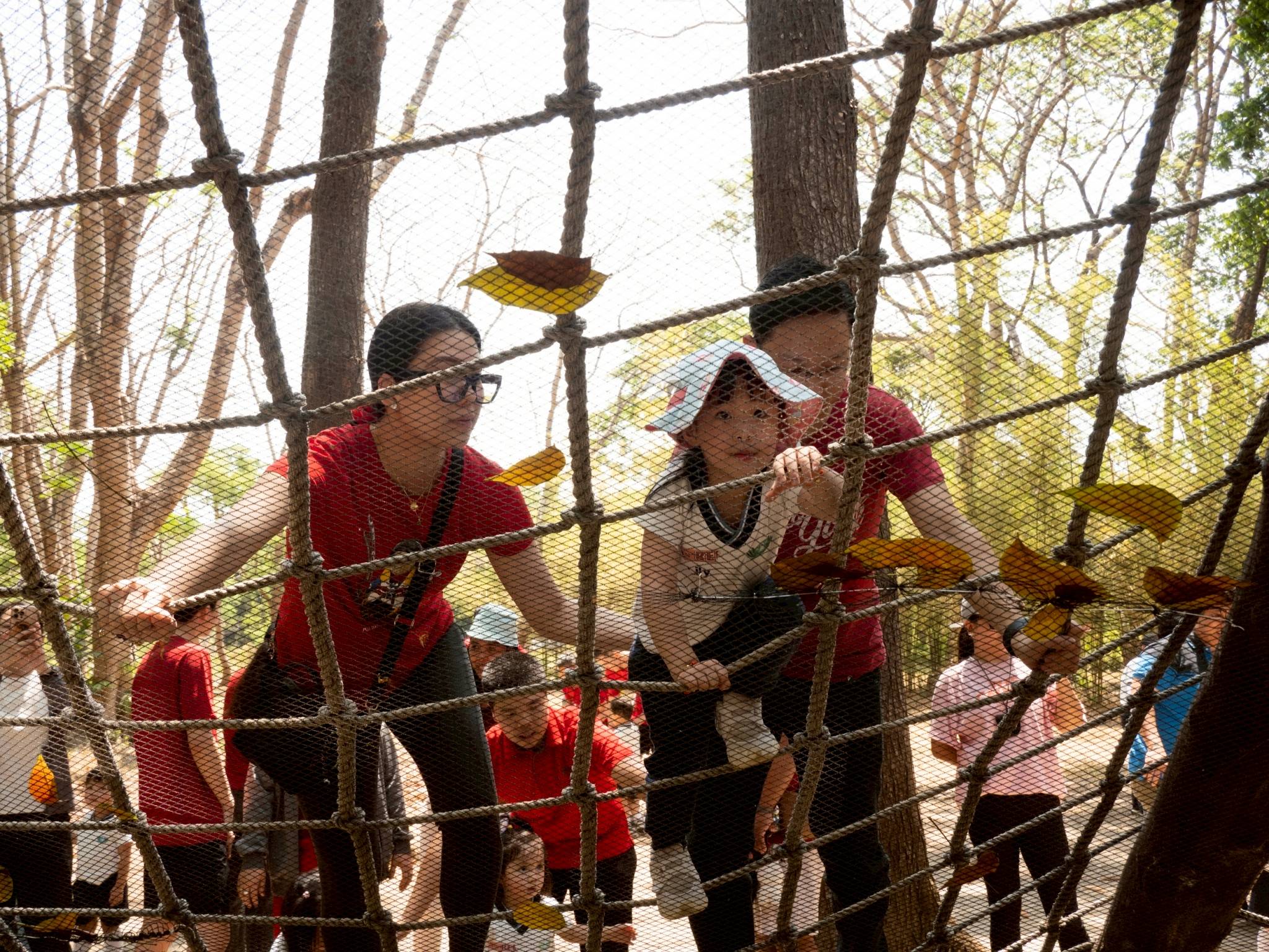 The obstacle relay included climbing up and down an A-frame cargo net, a fun challenge for both parents and kids.