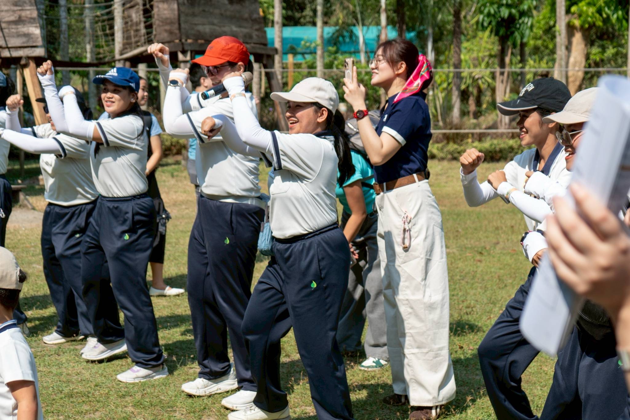 Faculty staff of the preschool lead a joyful dance activity for students and their parents.