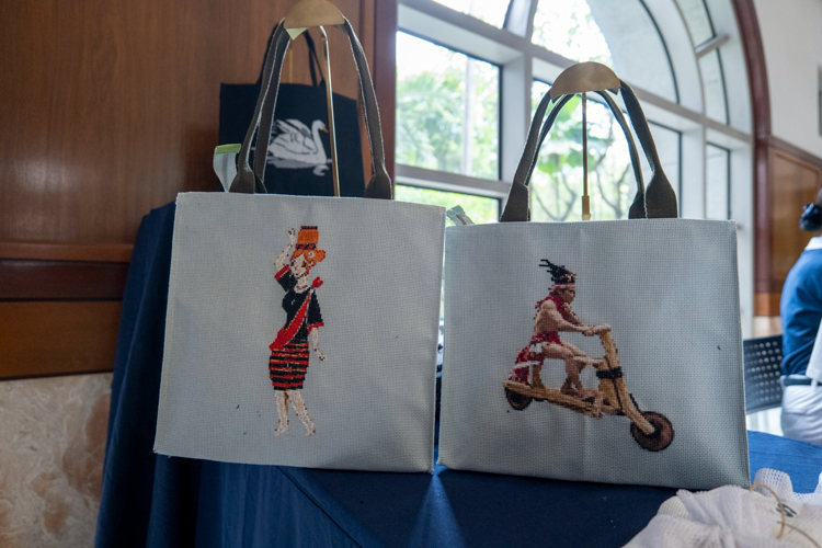 Clean, cross-stitched handiwork is the trademark of bags and pouches made by the women of Tzu Chi Palo Great Love Village. 