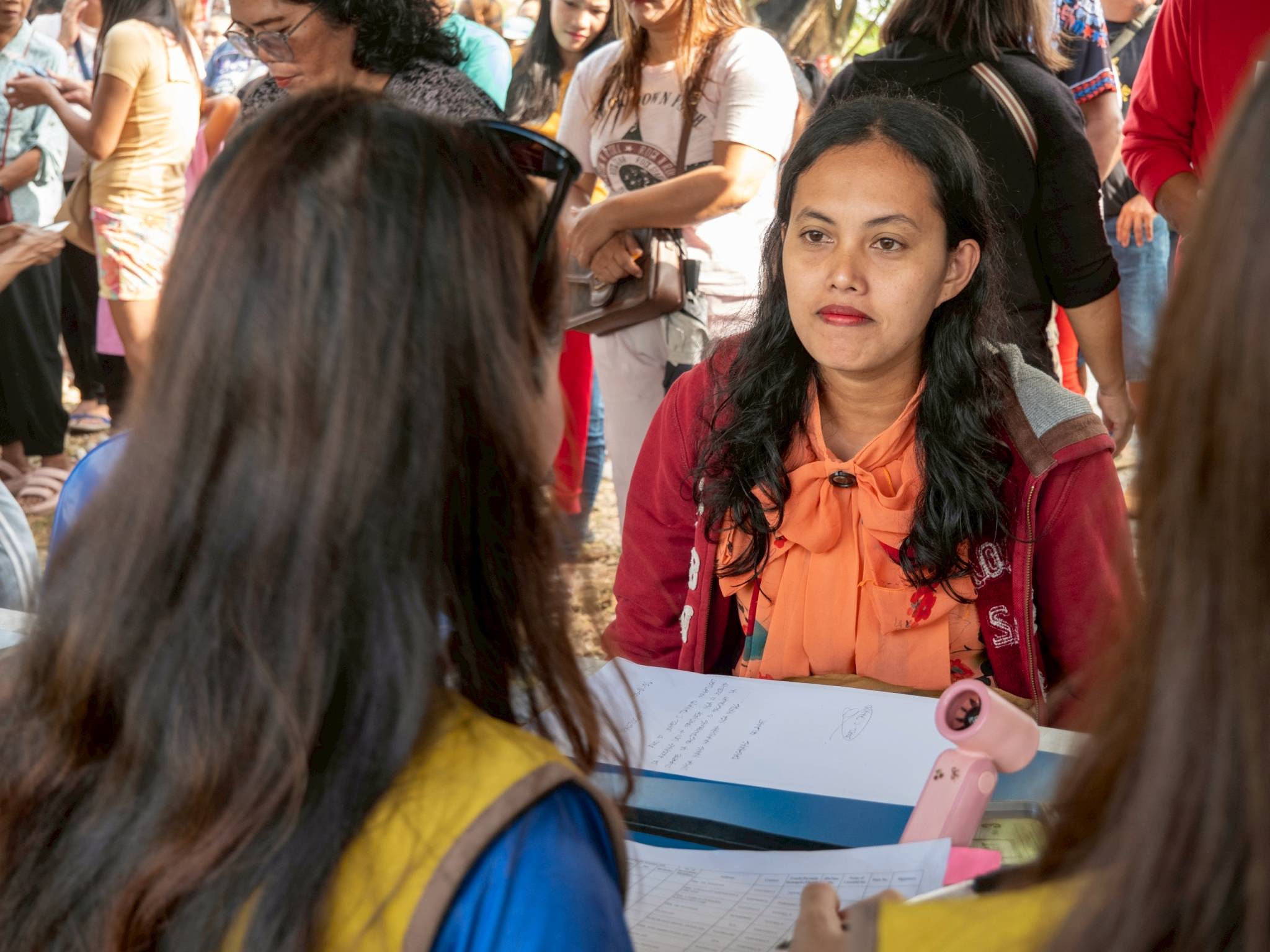 Volunteers from Iligan Medical Center College also assist in the registration of typhoon-affected beneficiaries claiming relief.
