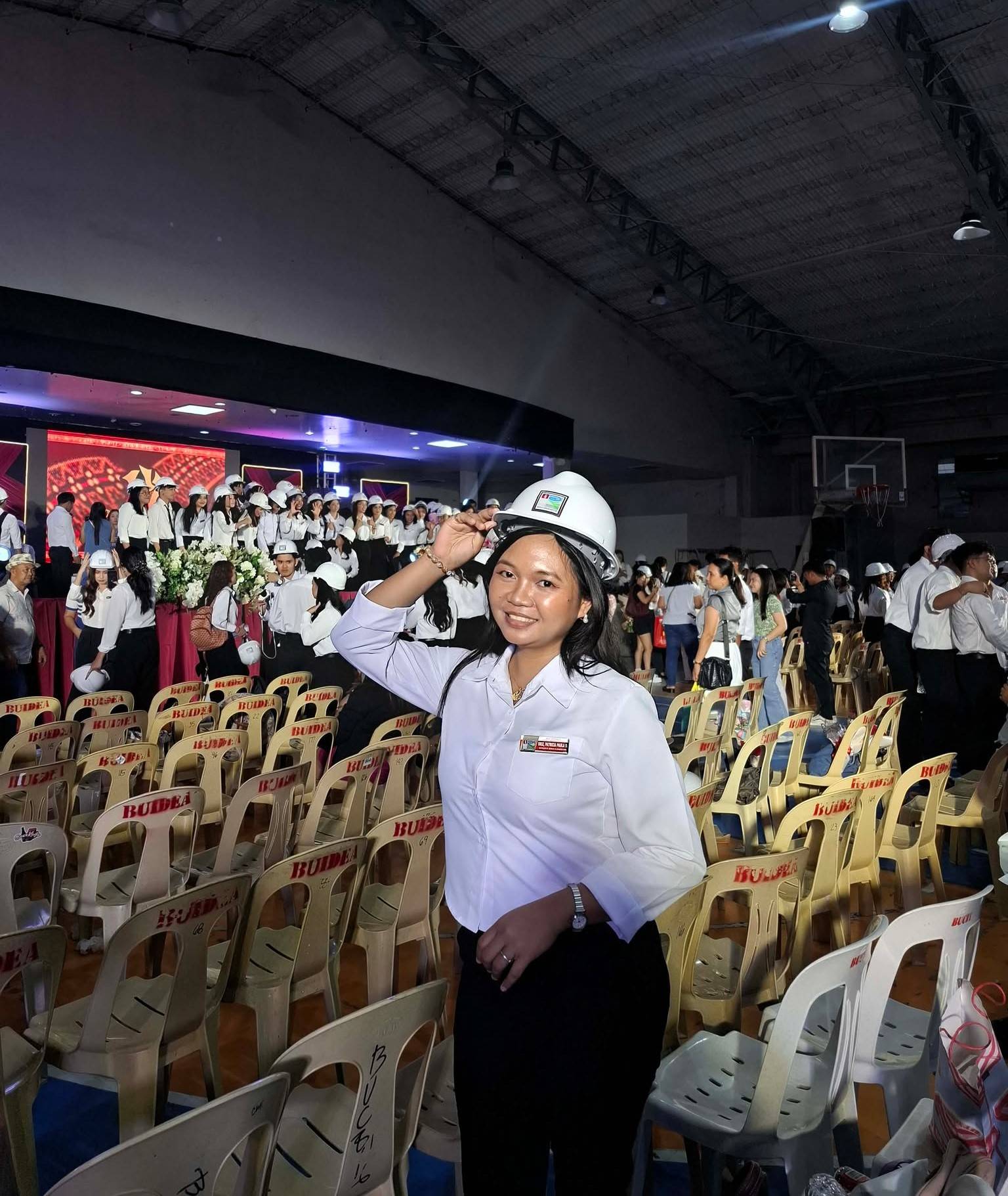 Wearing her hard hat with pride, Patricia Paula Briz officially takes another big step toward her dream at a special hard hat and pinning ceremony for Bicol University’s future architects. 