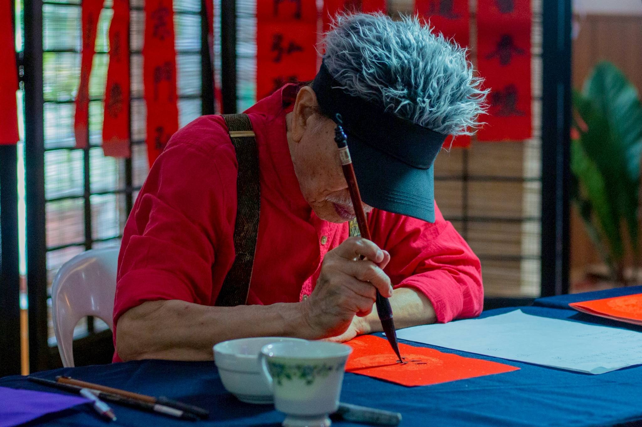 Alfonso Co Ong is one of the regular calligraphers of Tzu Chi’s Year End Blessings.