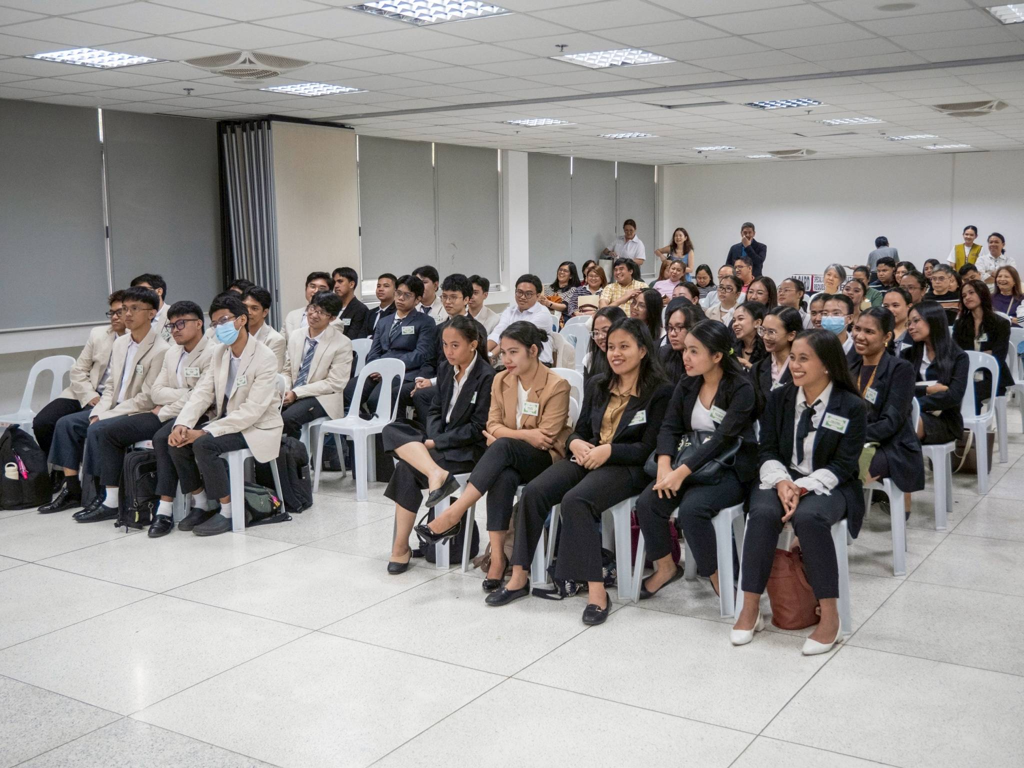 Graduating Tzu Chi scholars arrive in business attire, ready to take on mock interviews led by volunteer industry professionals.