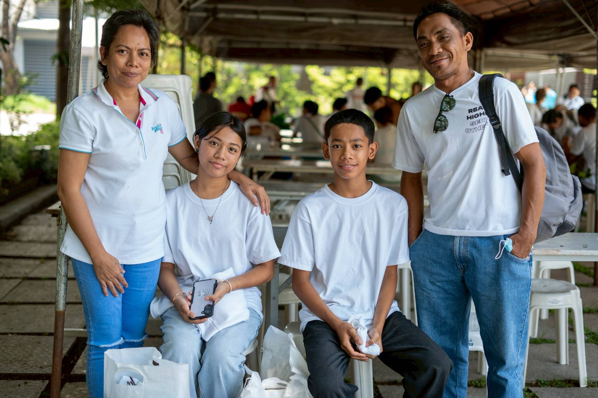 (From left) Roselyn Rodriguez with 14-year-old daughter Rhiana, 12-year-old son Russel, and husband Edison at the BTCC plaza on Charity Day. 