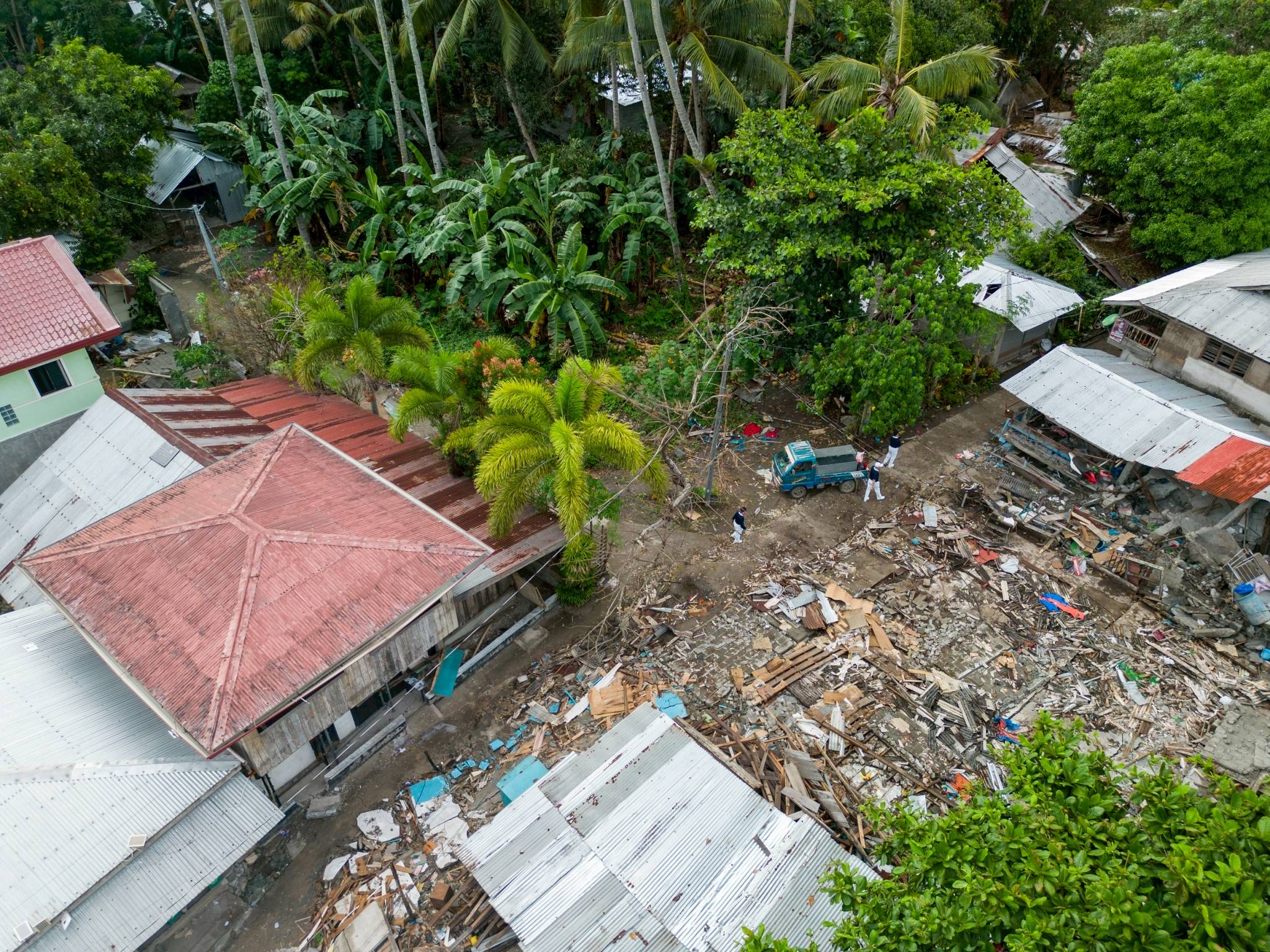 Homes appear to have been “erased” from where they once stood in this aerial view of a community in Jose Abad Santos, Davao Occidental, a week after the magnitude 7.8 quake struck on June 8. 