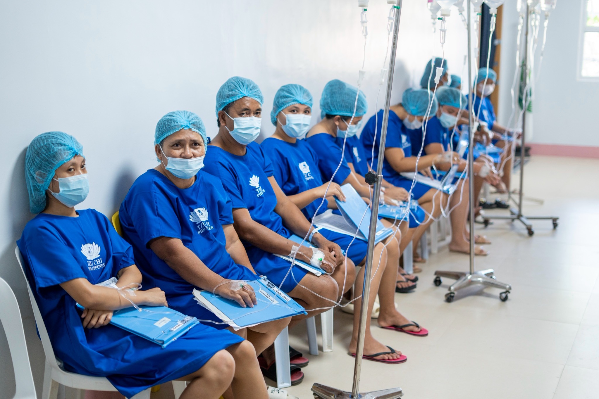 Prepped for their respective surgeries, Tzu Chi medical mission patients wait for their turn at the Zamboanga del Norte Medical Center.