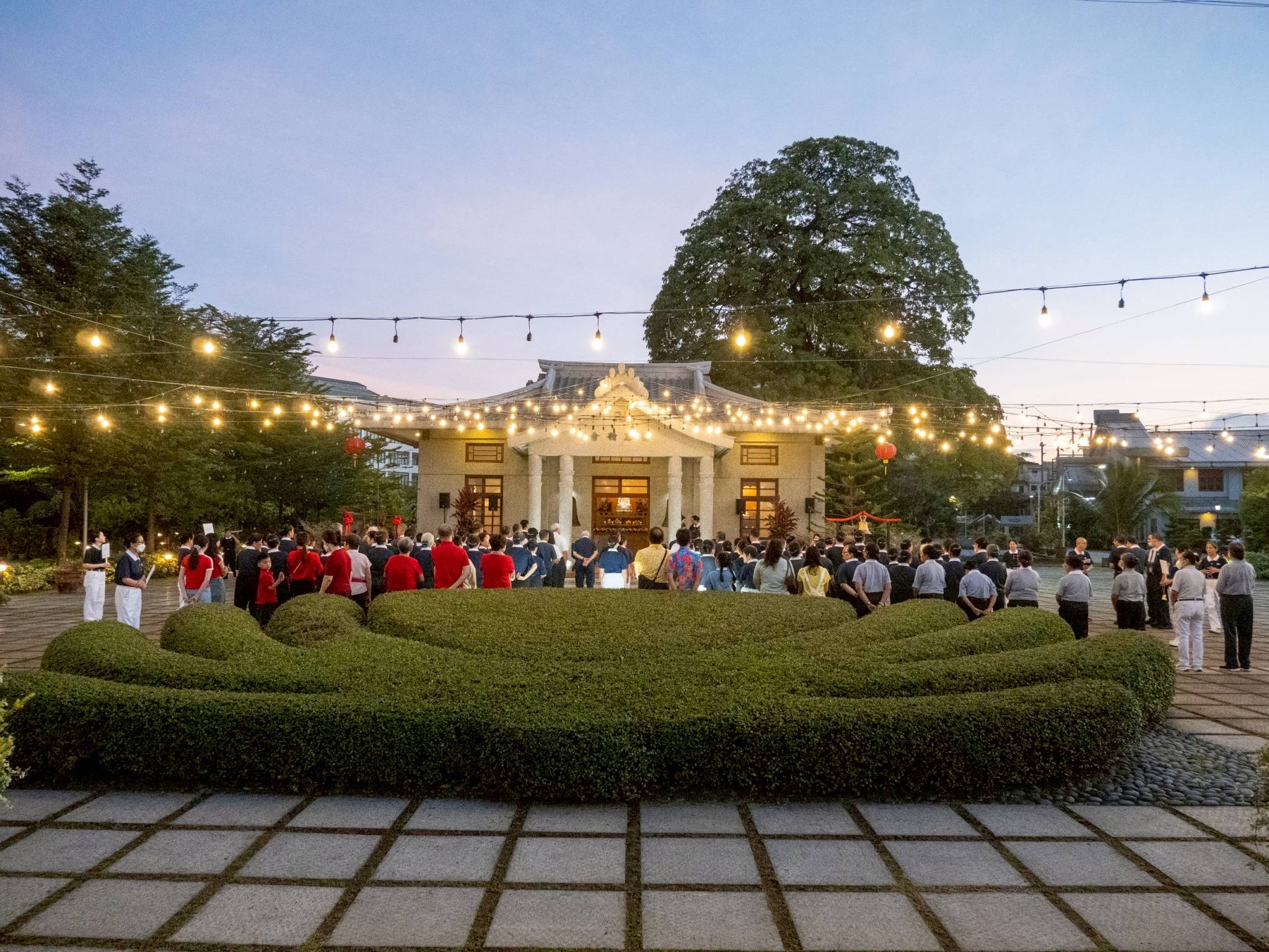 Golden rays of dawn illuminate Jing Si Abode as everyone gathers in the tranquil ritual of walking meditation.