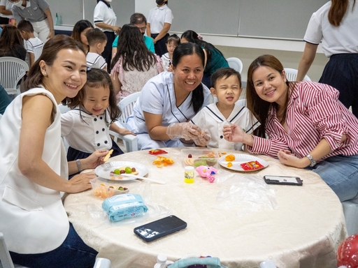 Parents and guardians had a wonderful time creating fruit art during the Mid-Autumn Festival celebration.