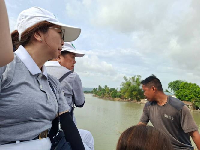 Riding transport trucks, Tzu Chi Bicol volunteers witness the devastating aftermath of Tropical storm Kristine, in their region.