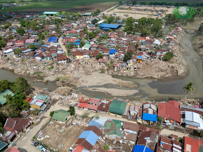 An aerial view shows Barangay Roberto S. Benedicto in La Carlota City more than a month after Typhoon Tino struck the area, revealing the extent of damage left by the flooding.