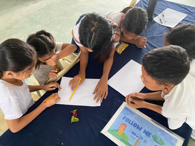 Children ages 7-13 participated in a fun drawing activity on how they can protect the environment.