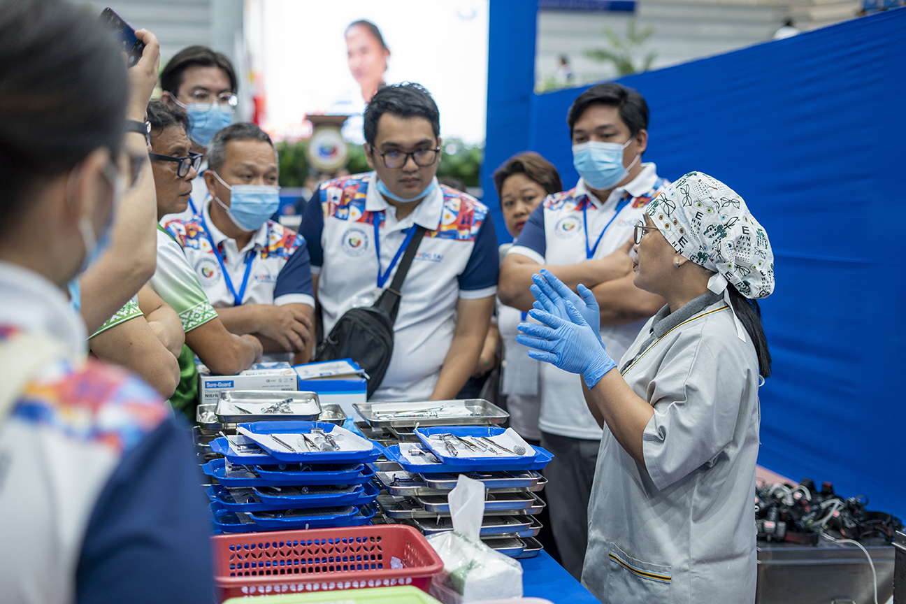Armi Belita (first from right) leads LGU staff in preparing assistance for the dental team on Day 1 of the medical mission.