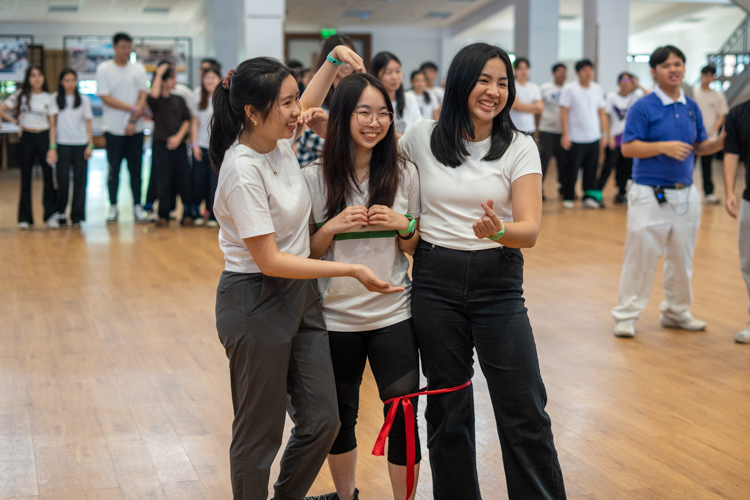 Participants freeze in position during the “Red Light, Green Light” game.