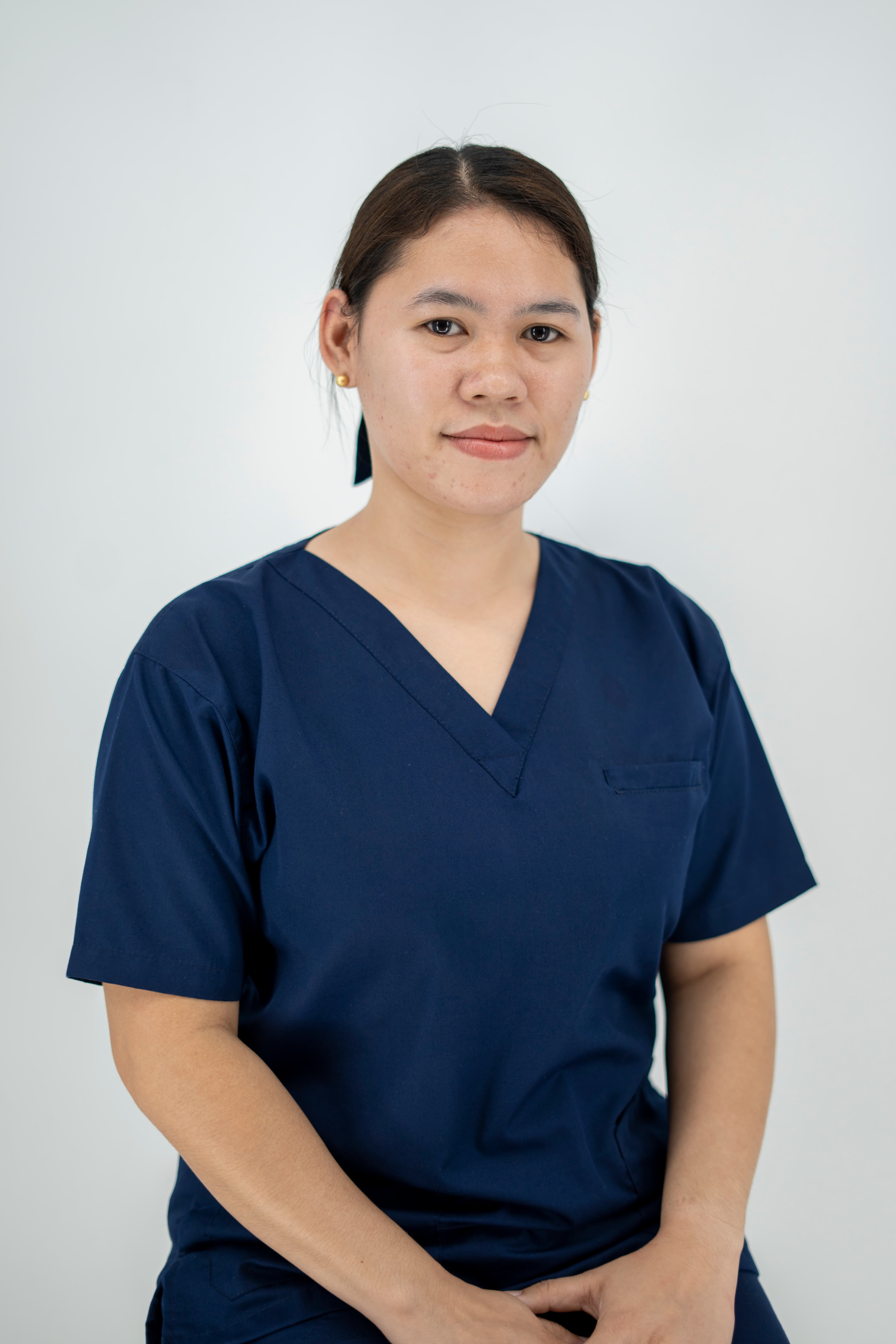Caregiving scholar Renancie Abiera defied the odds, becoming her family’s first graduate through Tzu Chi’s caregiving program despite her parents' initial doubts.