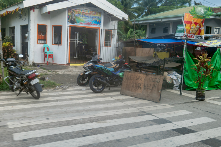 On the way to San Remigio, signs calling for help could be seen on the streets.