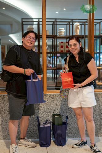 Sonny Chua and Arlene Sy show off the items they bought from the Tzu Chi bazaar. “We’ve been seeing a lot of Tzu Chi’s charity work and every time there’s an event, we always come to support them,” said Arlene.