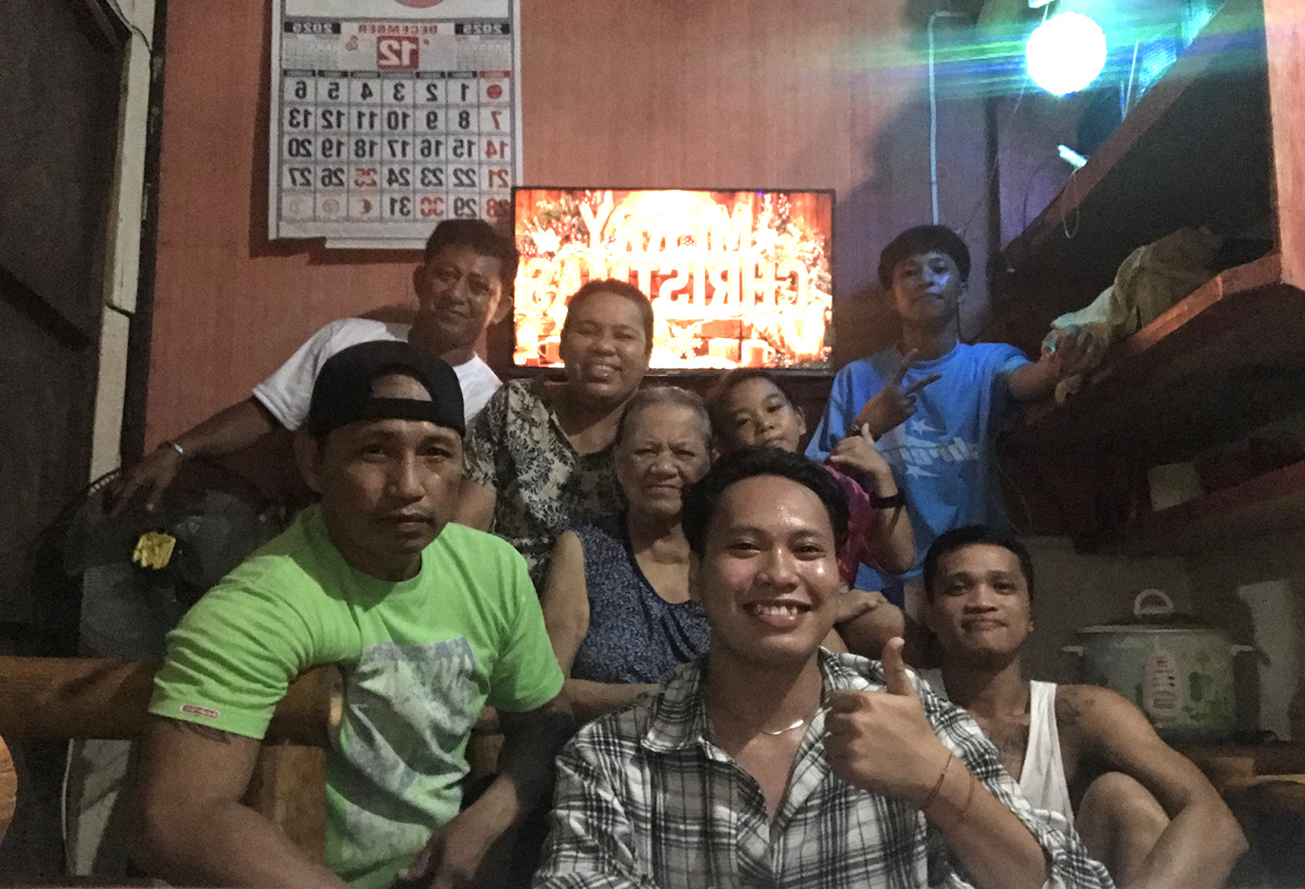 Mark Kent Cabradilla (front, in checkered shirt) shares the joy of Christmas with his family.