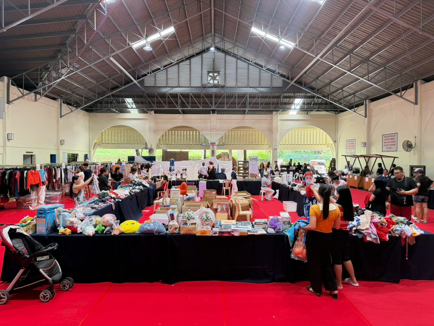 Early shoppers browse pre-loved clothes, toys, shoes, and bags at Tzu Chi’s charity bazaar in Ayala Heights Village, Quezon City, on October 24.