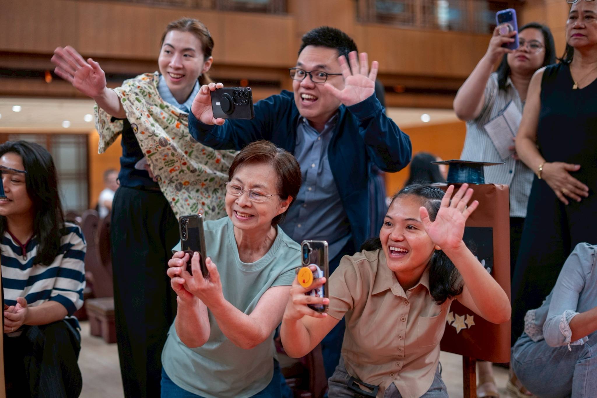 Families try to catch their kids’ attention for that perfect picture. 