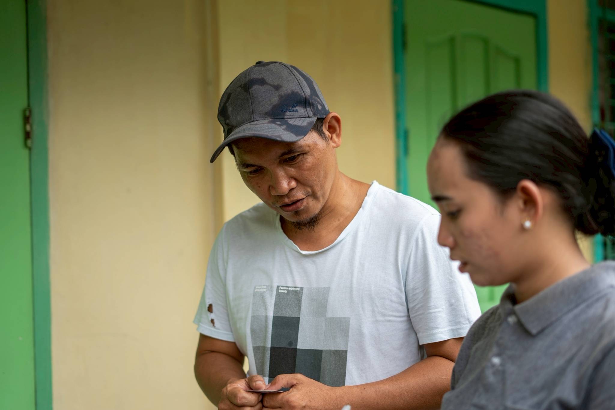 Kalbay National High School Grade 8 math teacher Reggie Laurence Danganin (left) was relieved that everybody was outside for the National Anthem when the quake occurred. “By the grace of God, we have no casualties,” he said. 