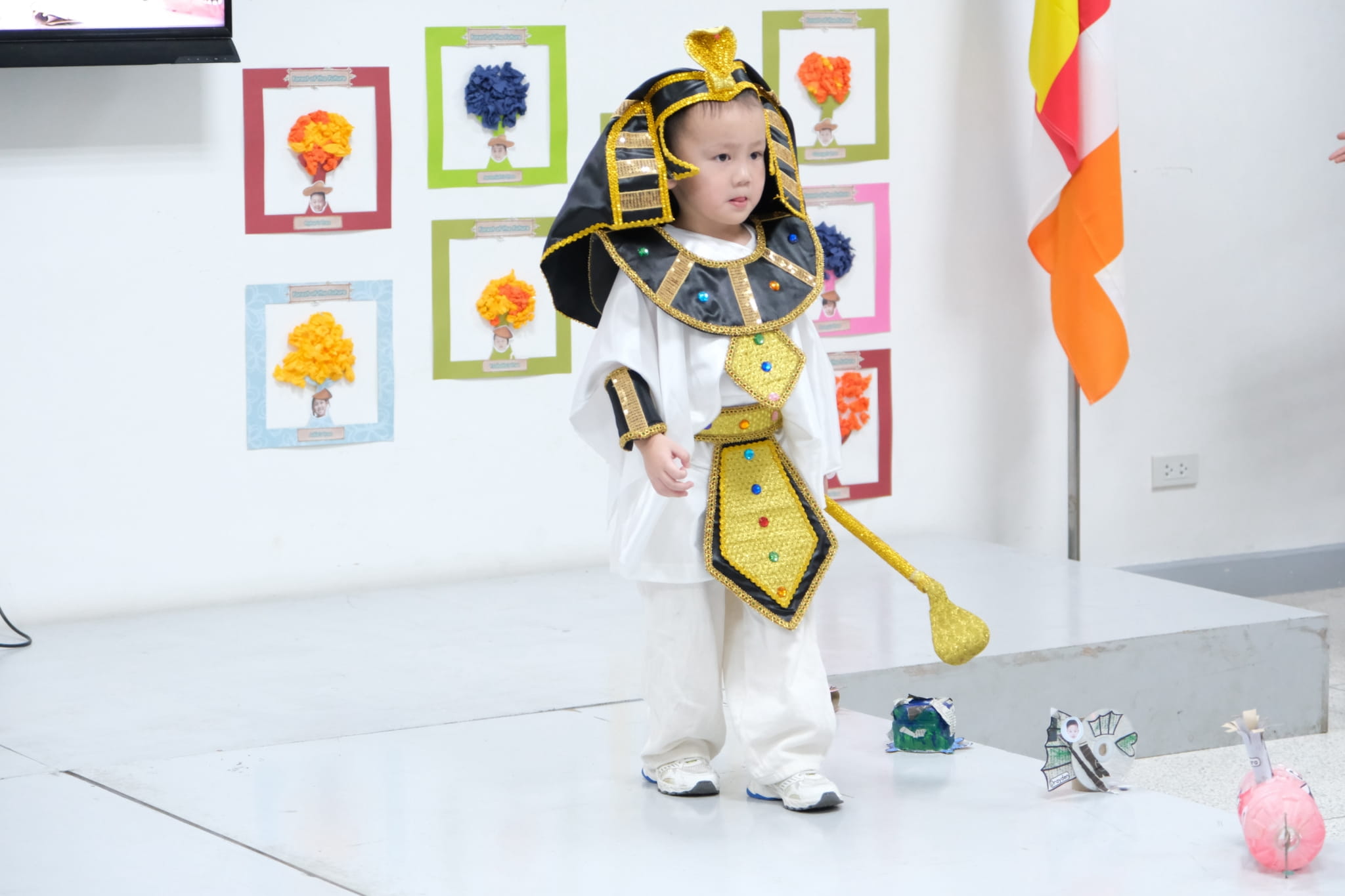 Preschoolers steal the spotlight in their colorful traditional costumes.