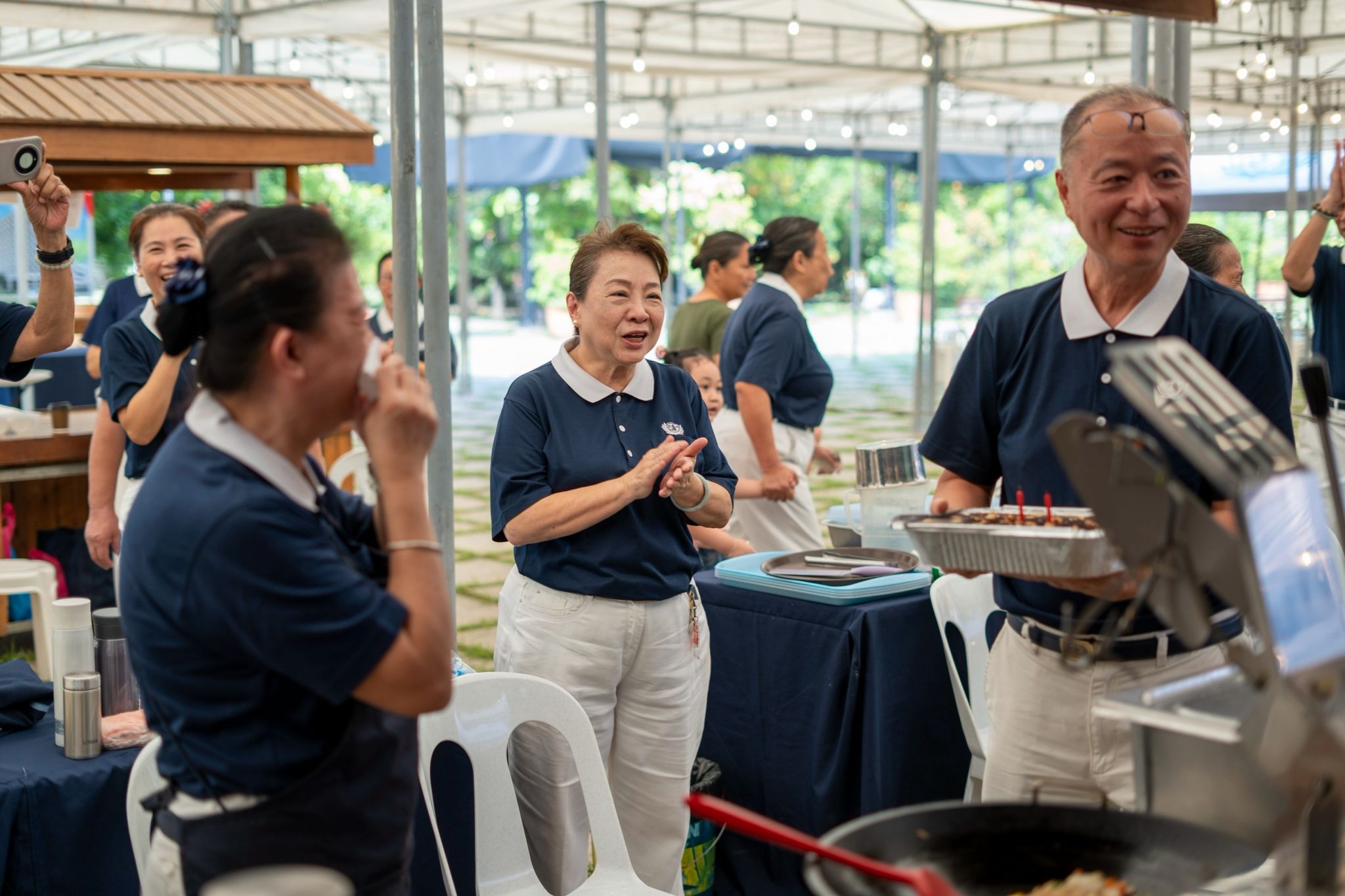 Tzu Chi volunteer Emelita Tan was surprised with a birthday cake by her fellow volunteers during Day 2 of the food bazaar.