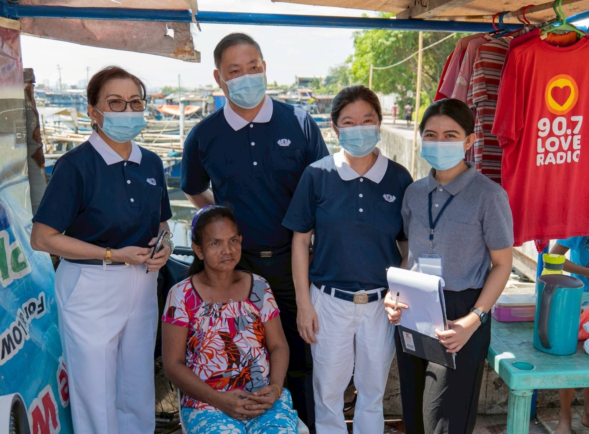 Now a Registered Social Worker and a Social Welfare Officer at Tzu Chi Foundation, Shekinah Salazar (first from right) extends compassion to the beneficiaries she meets. 