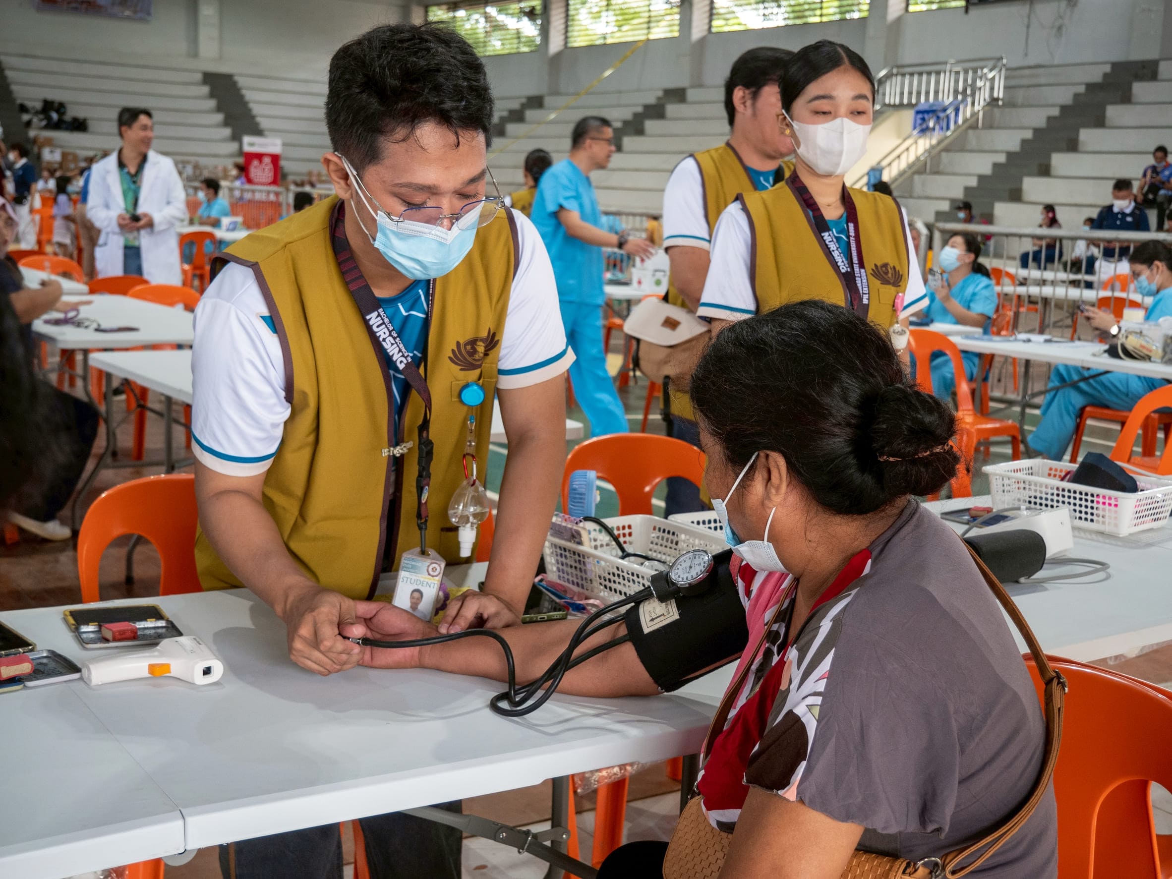 A patient gets her vital signs taken by a student from Mindanao State University Buug Campus School of Nursing-Ipil Extension. 