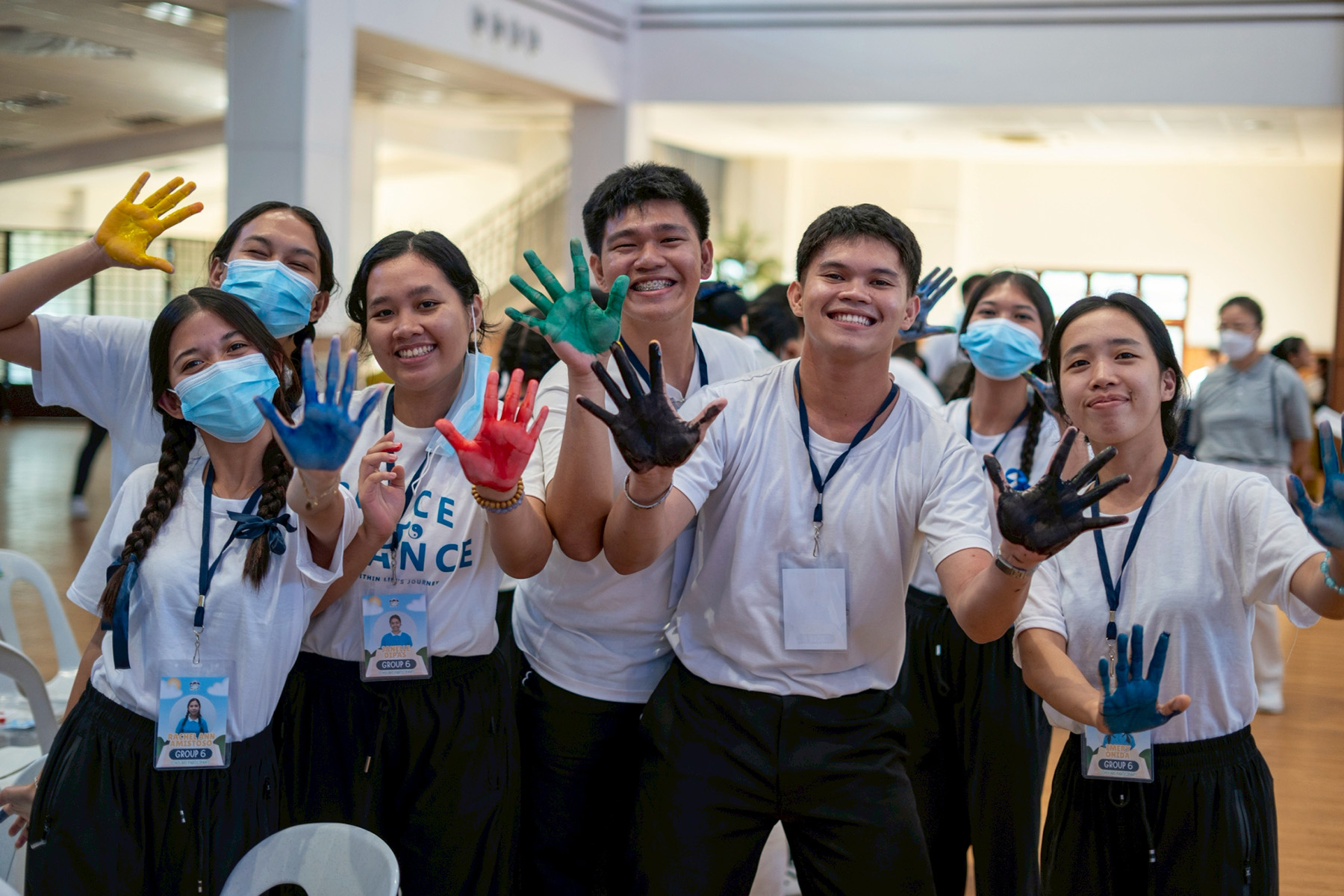 Many groups designed their banner with colorful handprints. 