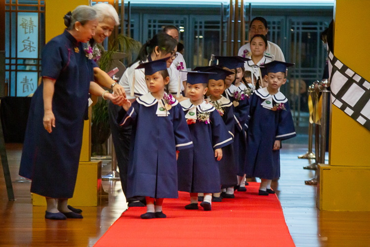 In this moving up ceremony, 15 students advance from pre-kindergarten to kindergarten.