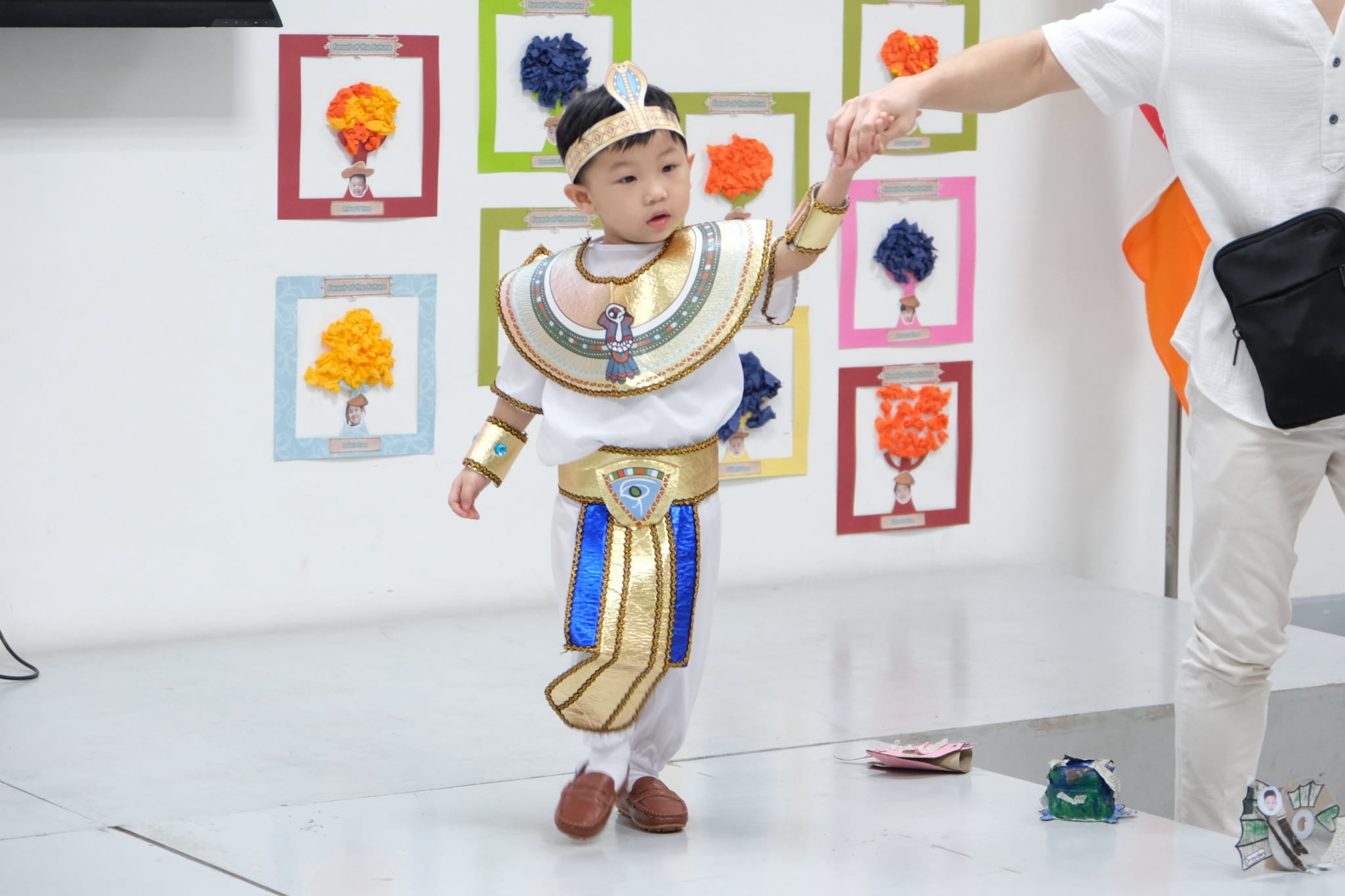 Preschoolers steal the spotlight in their colorful traditional costumes.