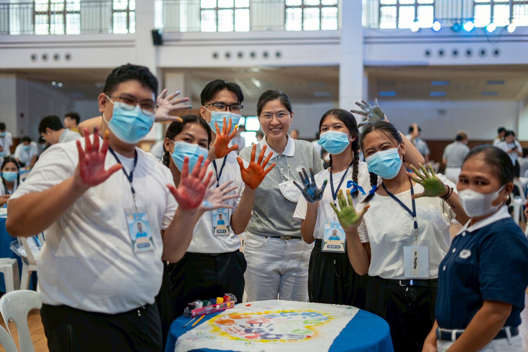 Many groups designed their banner with colorful handprints. 