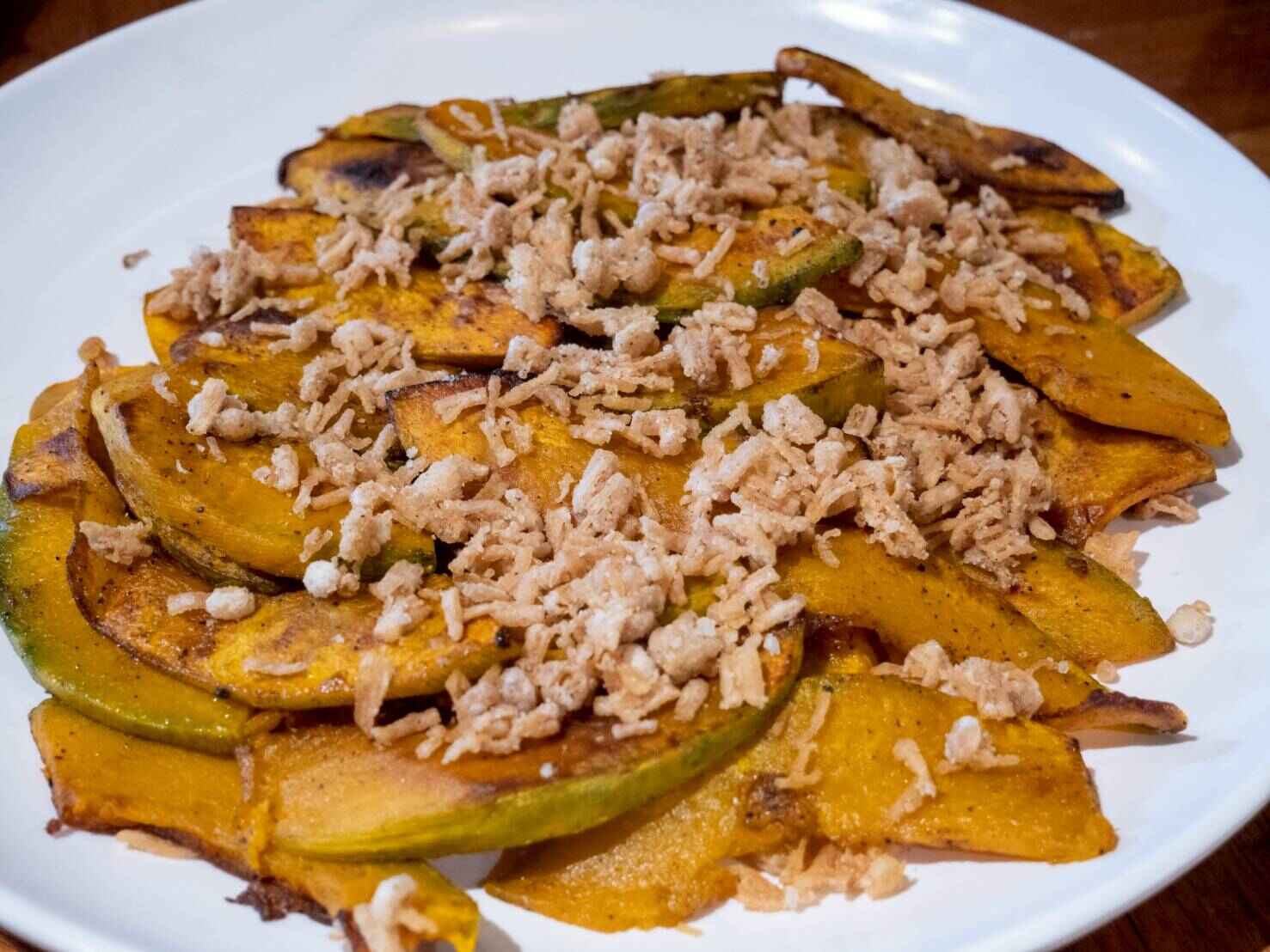 Grilled squash with crunchy enoki is smoked and tender grilled slices of squash sprinkled with savory, umami-rich fried enoki (mushroom).