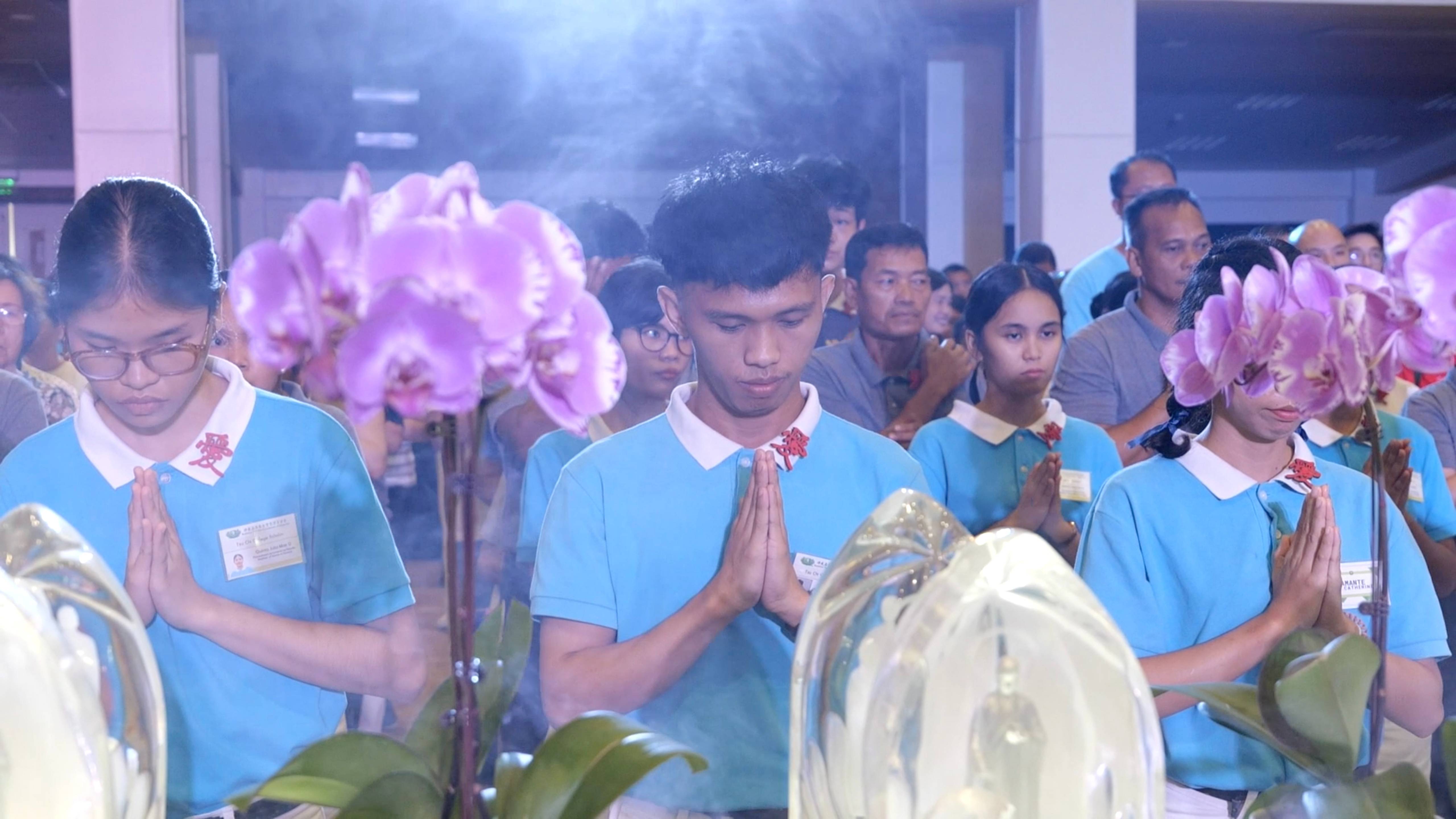 Graduating scholar Nhorhabib Acraman of Technological University of the Philippines (center) attends Buddha Day, possibly his last as a scholar, but hopes to return soon.