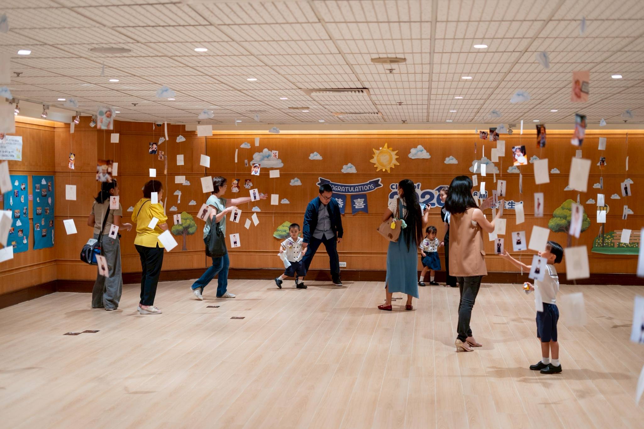 A portion of the Jing Si Hall was the designated Memory Lane Park, where photos of the students participating in activities during the schoolyear are displayed on the walls and hanging from the ceiling.