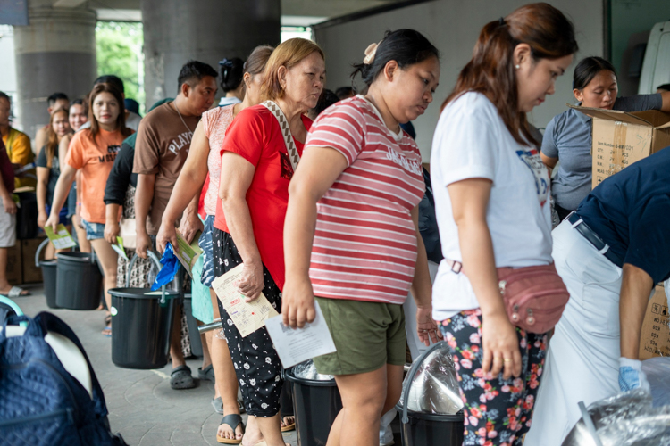 Each beneficiary received a pail of clothing, personal hygiene products, cooking supplies, basic kitchenware, and sacks of rice.