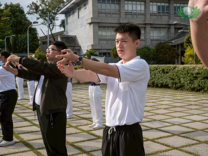 Alex Wu joins the morning exercises at the plaza.