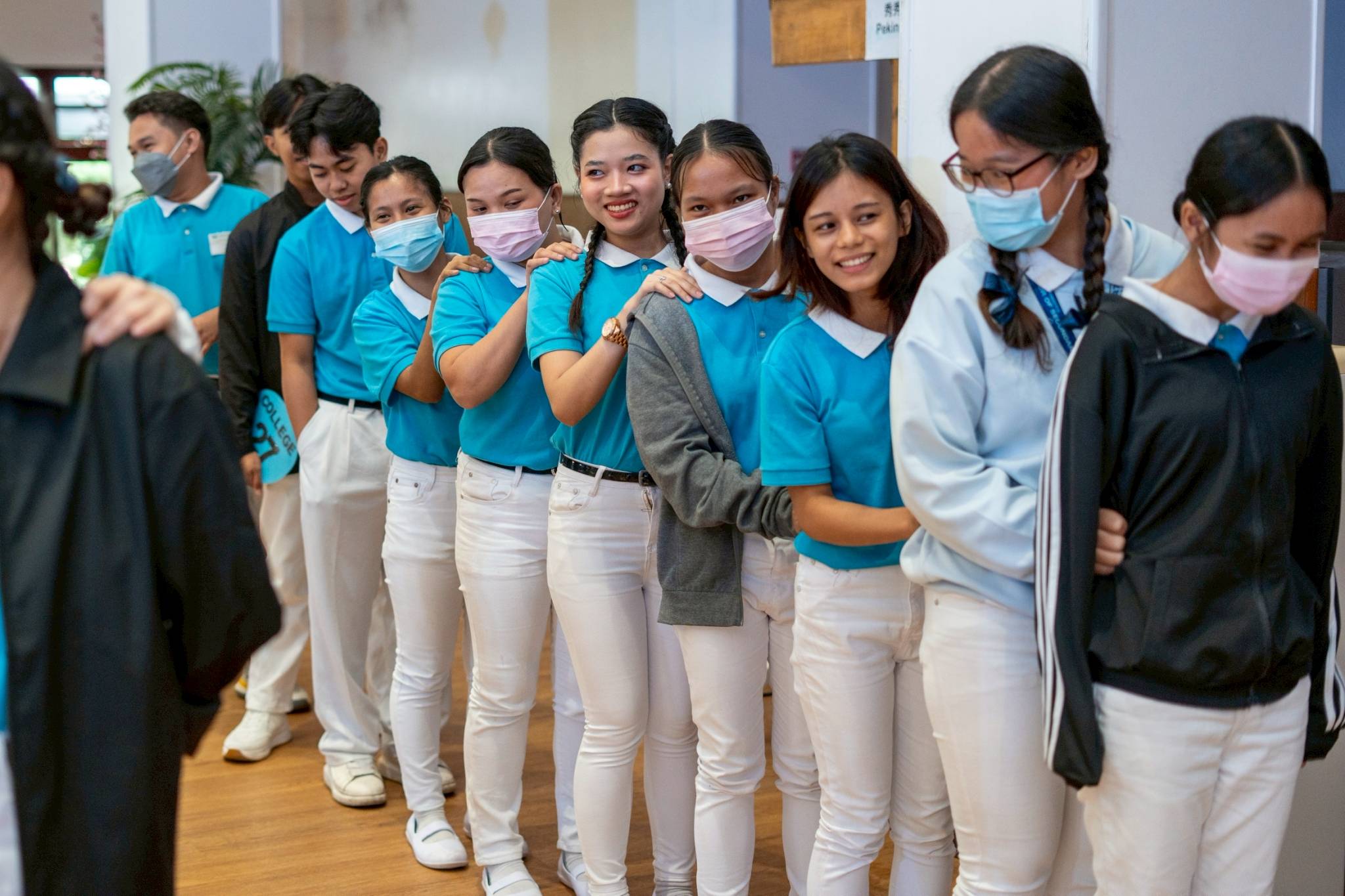 Ryza Corpuz (fifth from right) joined fellow scholars in the spirited group game, “Love, Hope, Joy.” 