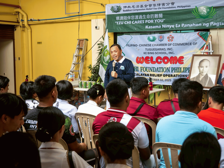 Tzu Chi volunteer Benson Lao gives a background on the Tzu Chi Foundation and its founder, Dharma Master Cheng Yen.