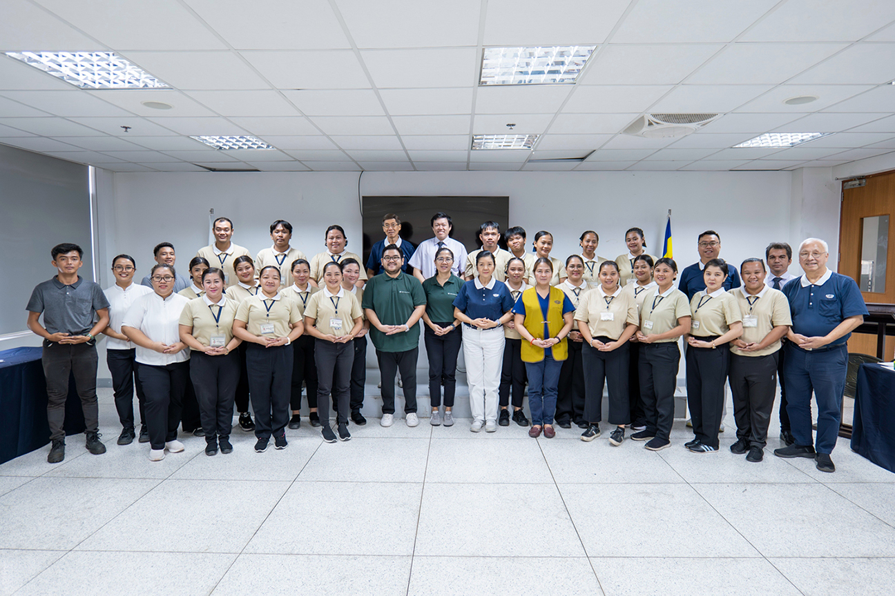 A group photo celebrates the renewed partnership and its continued mission to empower youth through education.