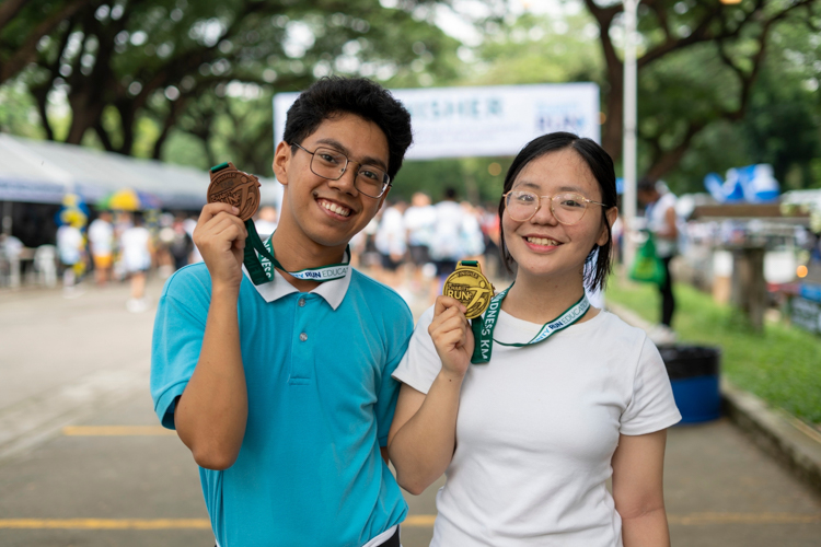 Tzu Chi scholars flex finishers’ gold and bronze medals.