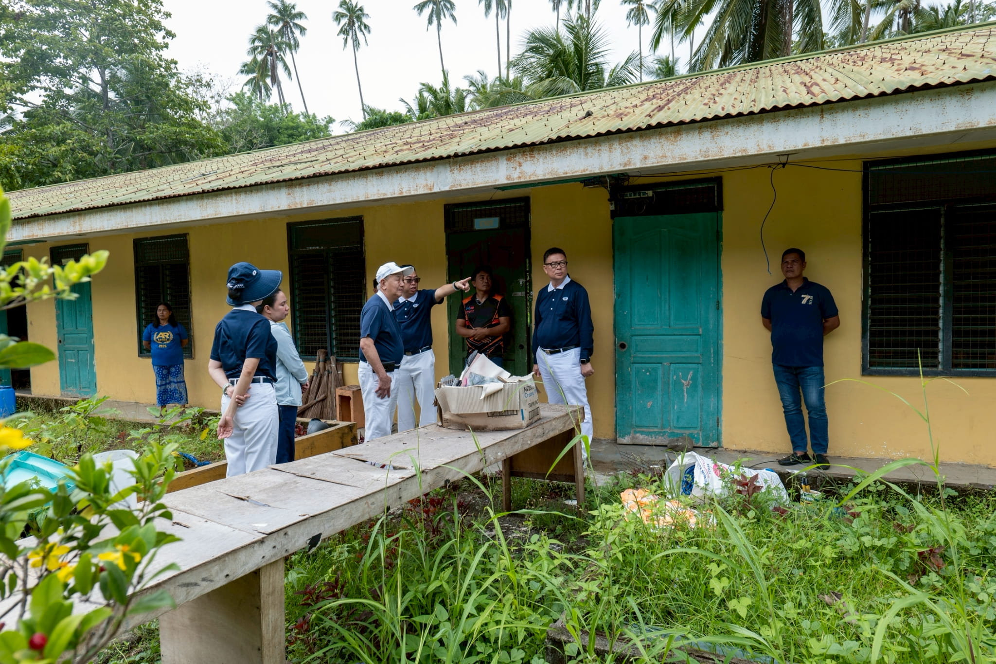Tzu Chi volunteers carefully assess the damage to determine how they could best help the school recover.