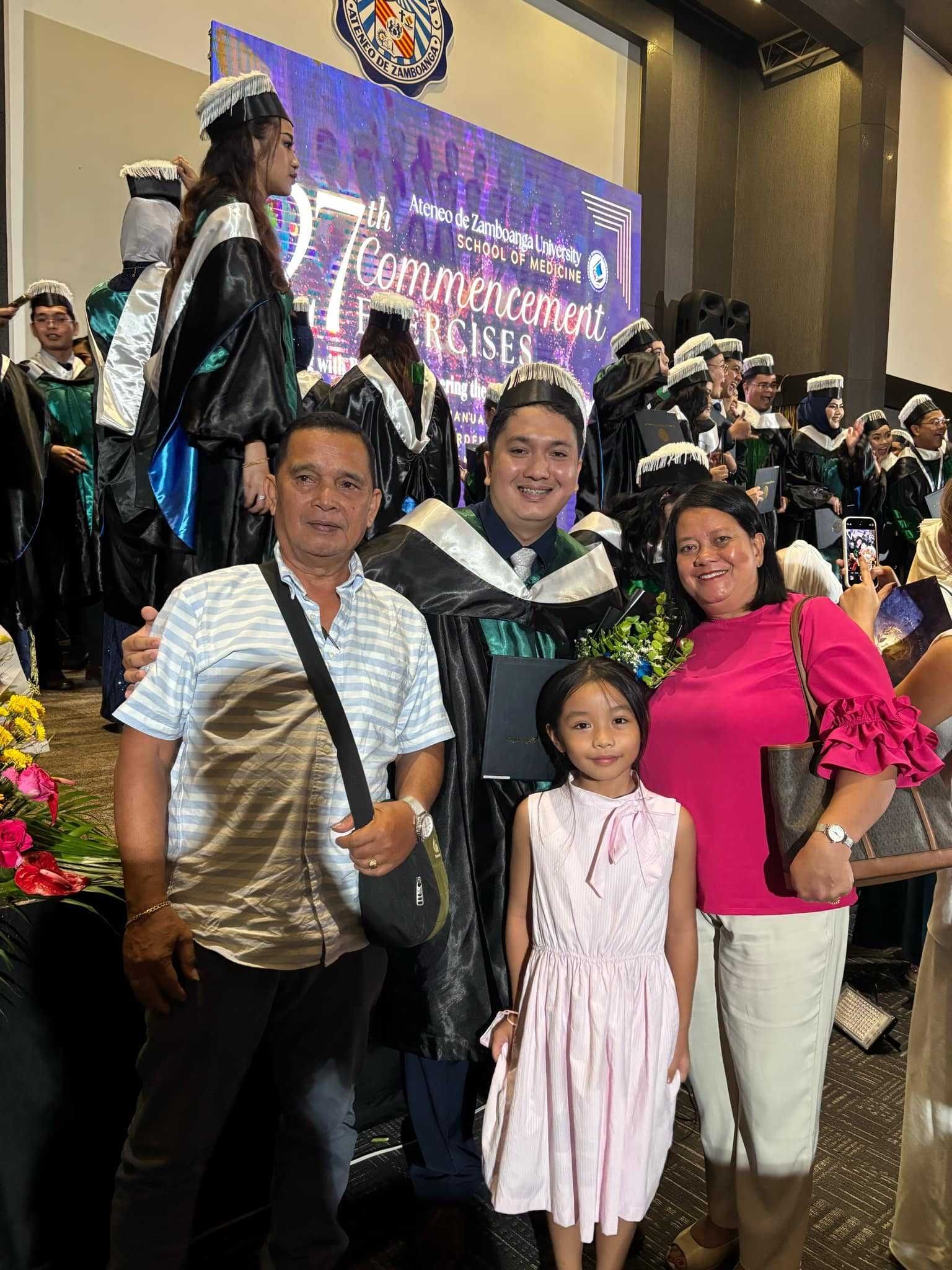 Edil-Joshua Ganas with his family, all smiles during his graduation. In his life, they are his greatest cheerleaders.