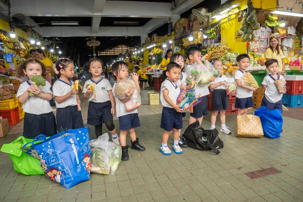 Students carrying their purchase after a successful shopping day.