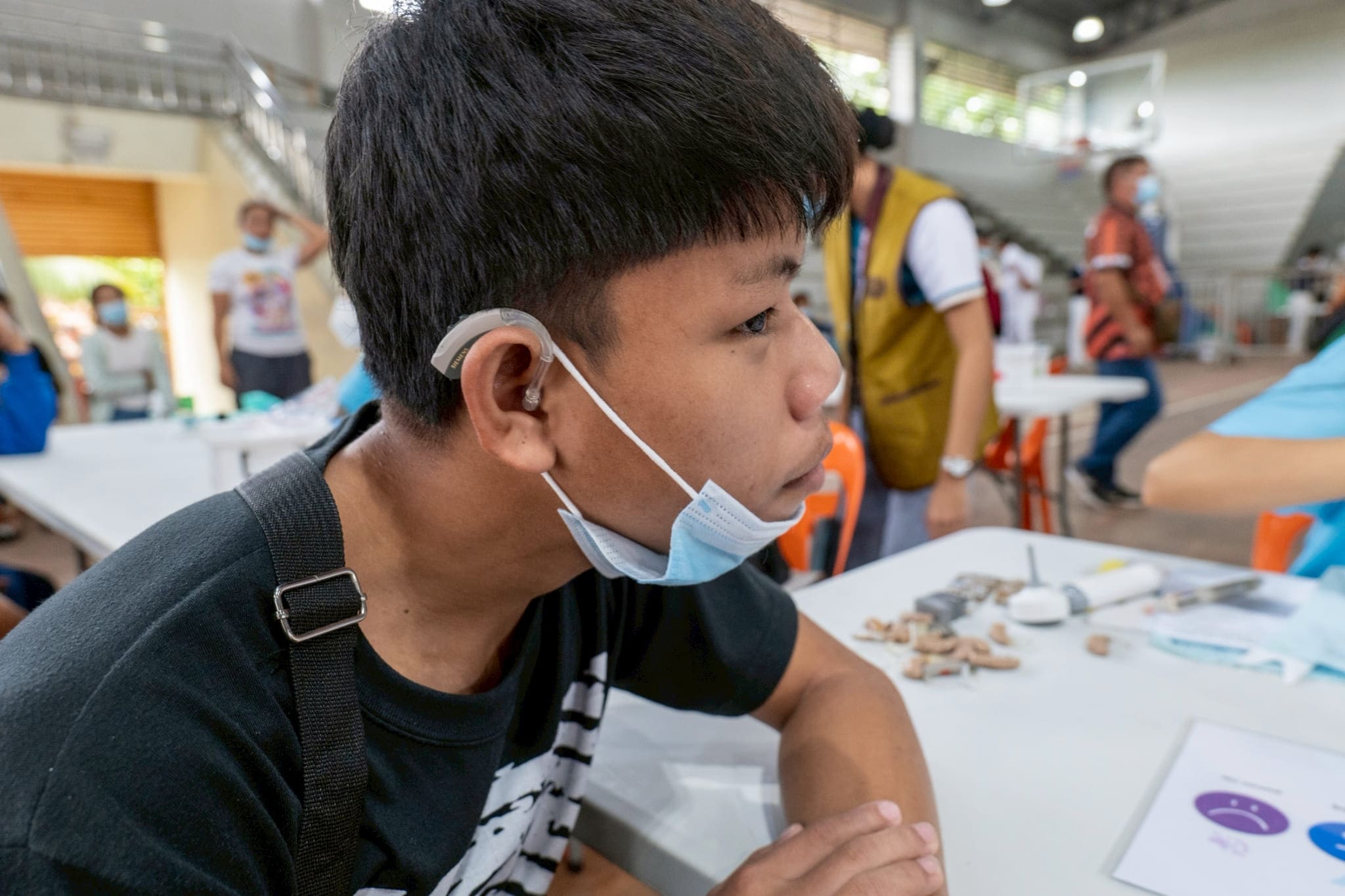 Hard of hearing since age 1, the now 18-year-old John-rell Pandalan can finally hear after volunteer doctors fitted him with a hearing aid. 