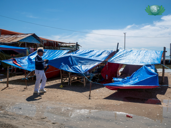 Tents made of tarpaulin serve as temporary shelter for families with totally damaged homes.