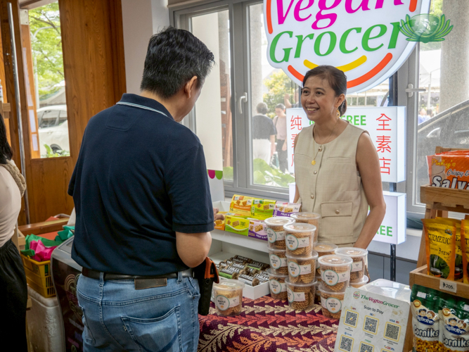 At the Harmony Hall: Auggie Yap Suratos, co-founder of The Vegan Grocer, assists a shopper.